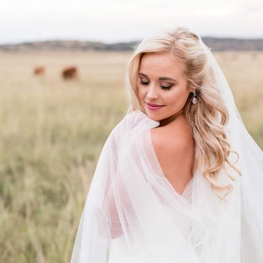 A bride with soft, elegant eye makeup and delicate shimmer, looking radiant.